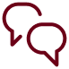 Two maroon speech bubbles overlapping, indicating communication or conversation.